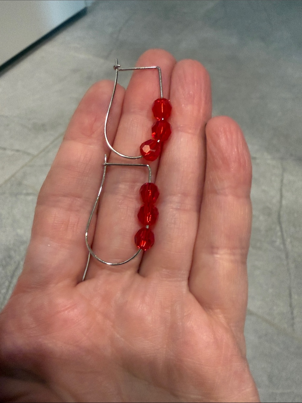 Touchstone Crystal Silver Hoop Earrings with Red Faceted Beads